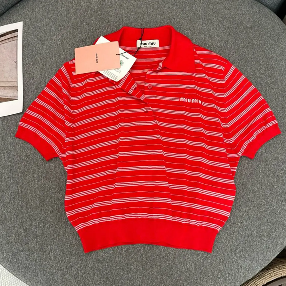 Side angle showing slim fit silhouette of Miu Miu red polo shirt