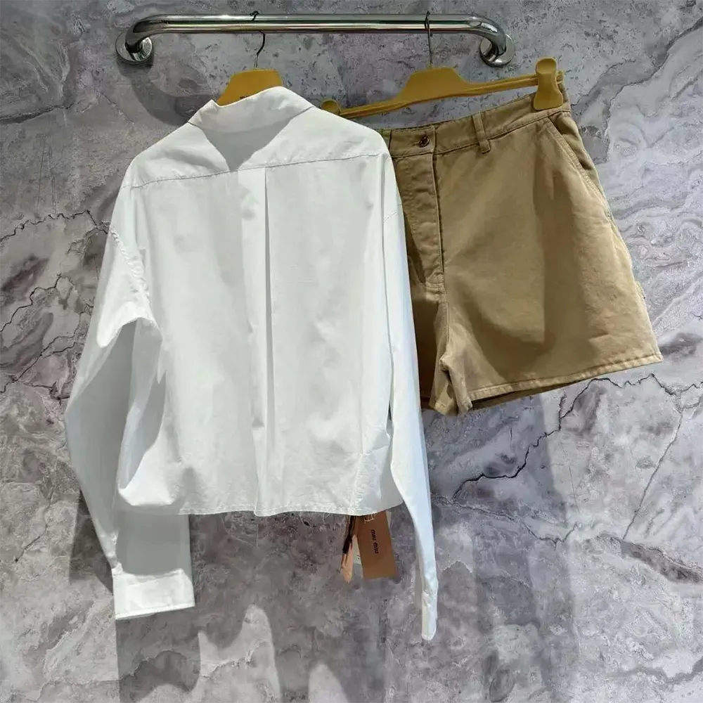 Side angle highlighting tailored fit of Miu Miu Women Striped Cotton Shirt