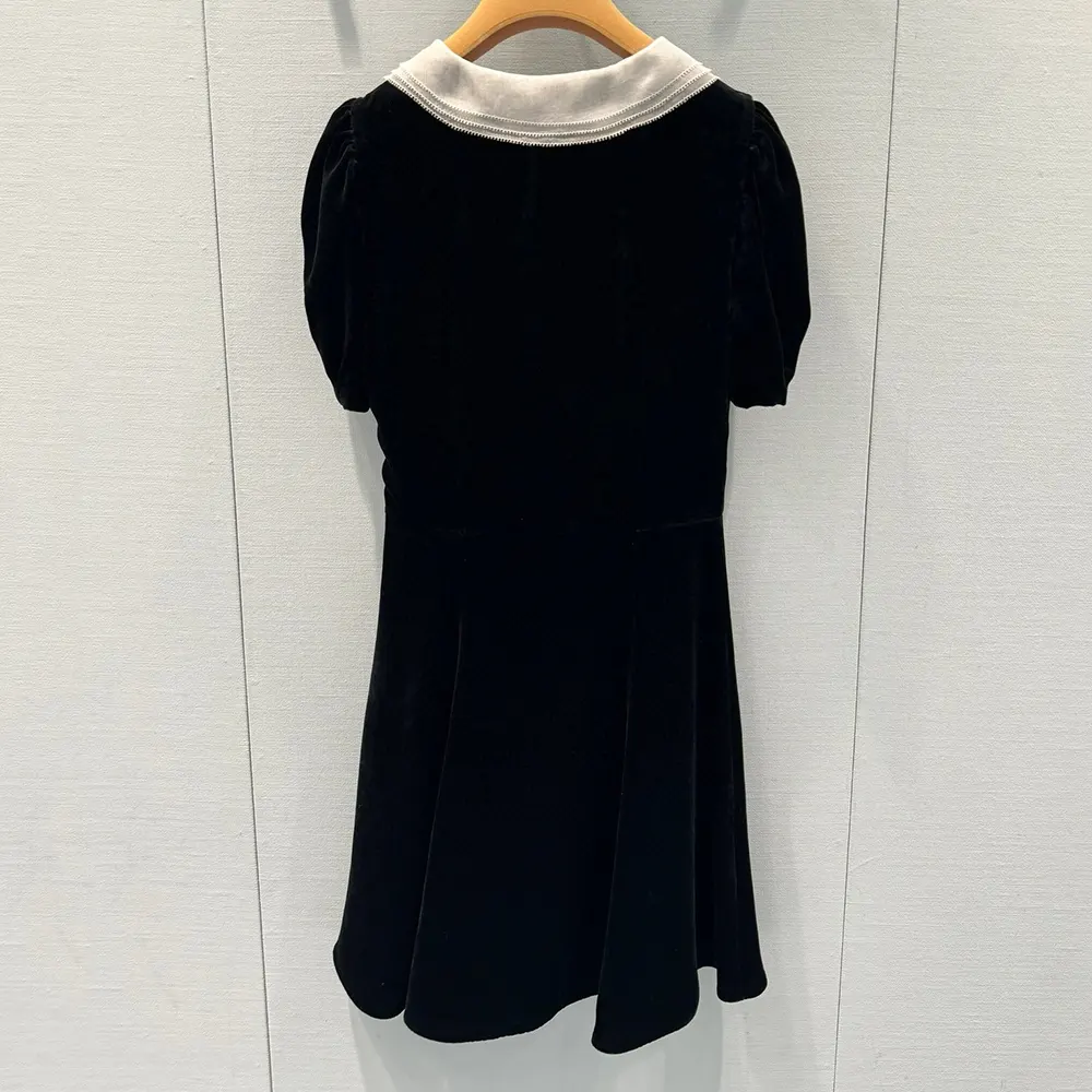 Side angle showing silhouette of Miu Miu Women Velvet Minidress