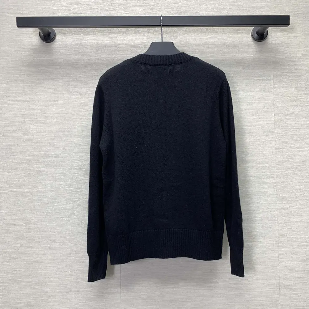 Side angle showing tailored fit of Prada Men Cashmere and Wool Prada Logo Crew-neck Sweater-Black