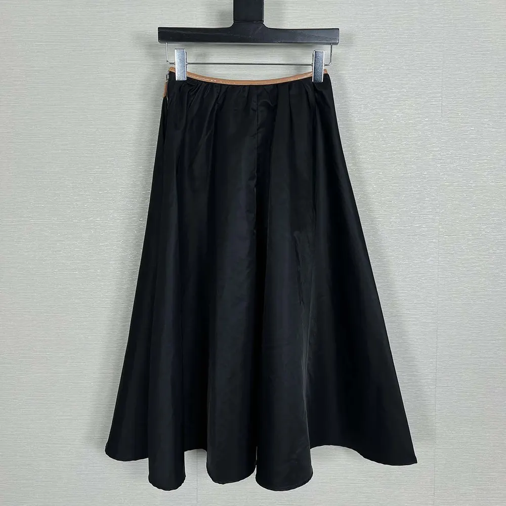 Close-up of signature Prada logo on Full Re-Nylon Skirt