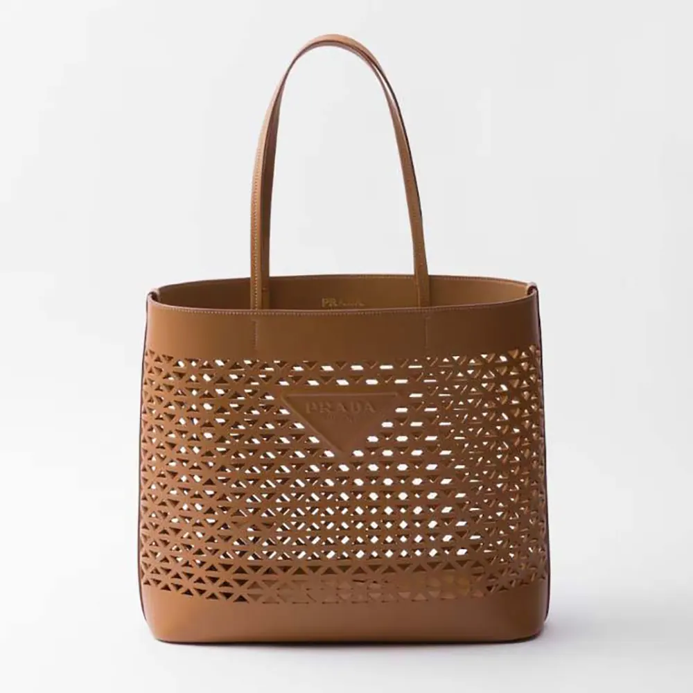 Front view of Prada Women Large Perforated Leather Tote Bag in brown
