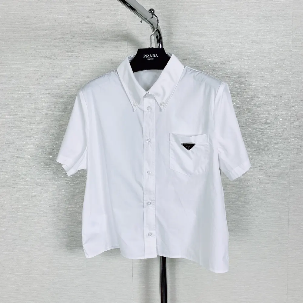 Side angle showing slim fit silhouette of Prada Women Poplin Shirt-White