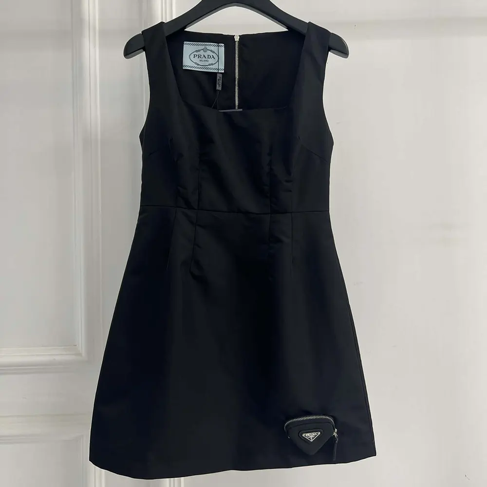 Close-up of Prada logo hardware on Re-Nylon Mini-dress