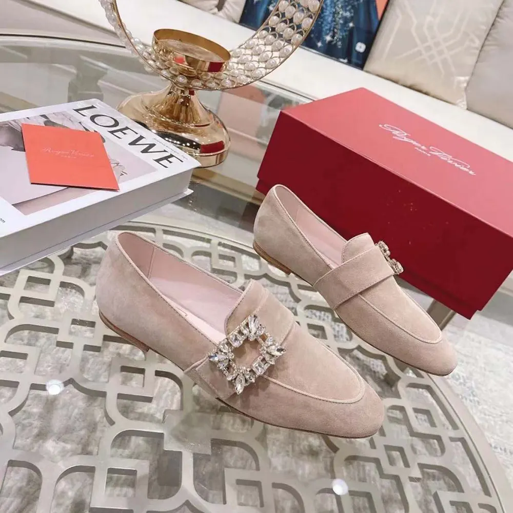 Close-up of sparkling strass buckle on Roger Vivier Mini Broche Vivier Ballerinas