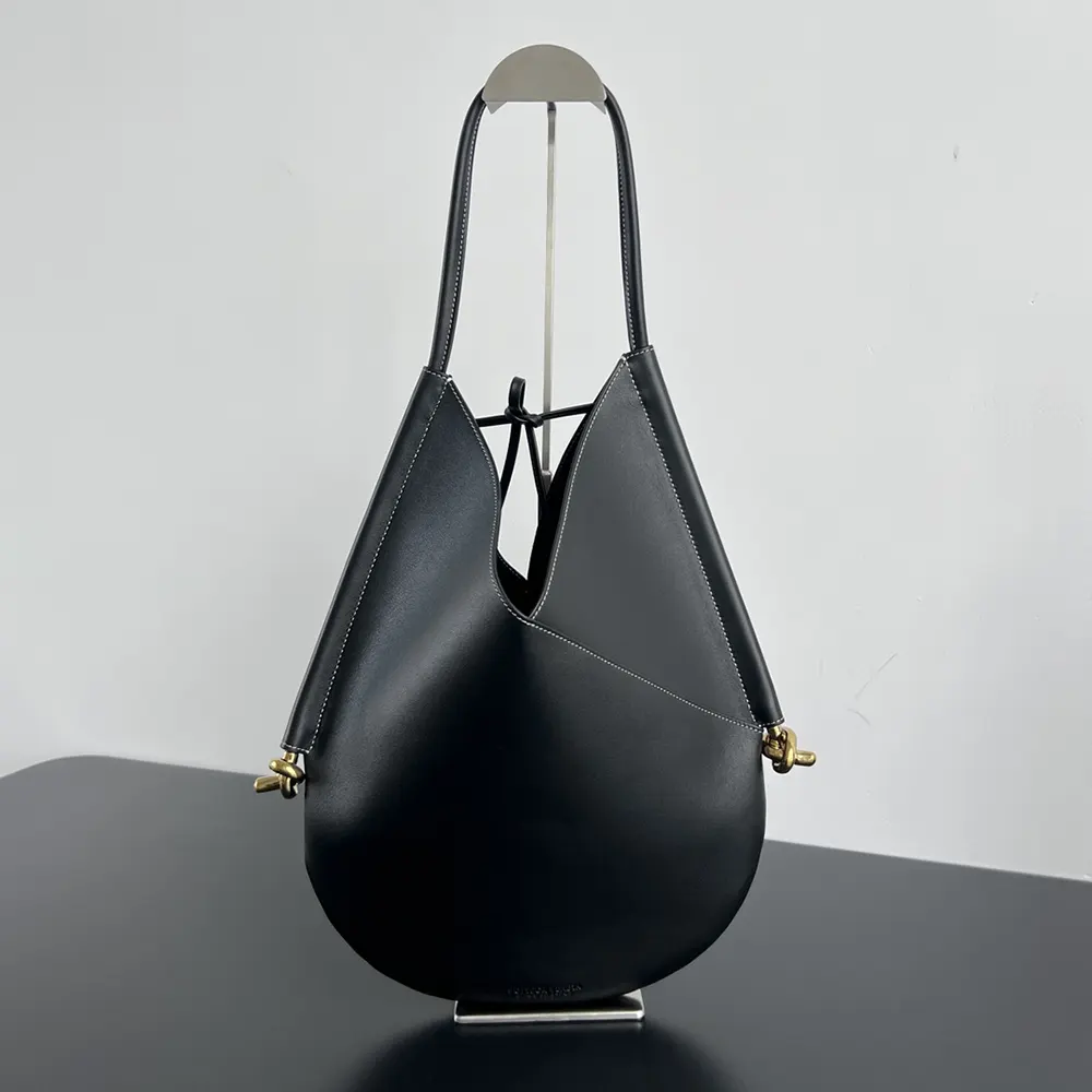 Side angle showcasing polished gold hardware on Bottega Veneta Small Solstice Shoulder Bag