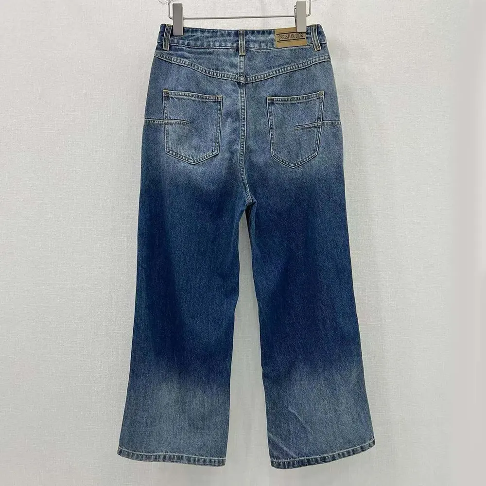 Close-up showing signature Dior stitching on Deep Blue Denim jeans