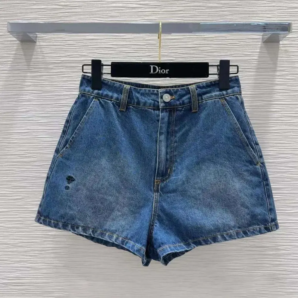Front view of Dior Women Shorts Blue Stonewashed Cotton Denim in navy