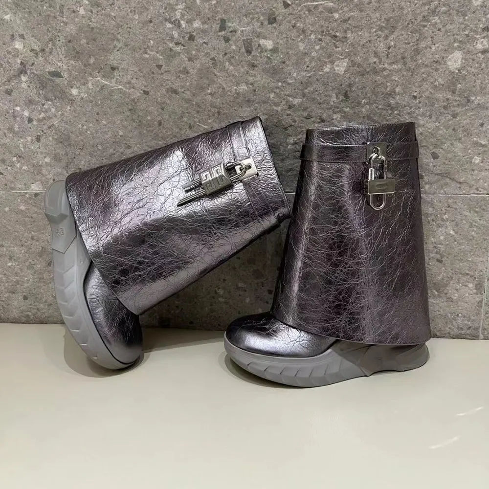 Close-up of silver Shark Lock hardware on Givenchy laminated leather boots
