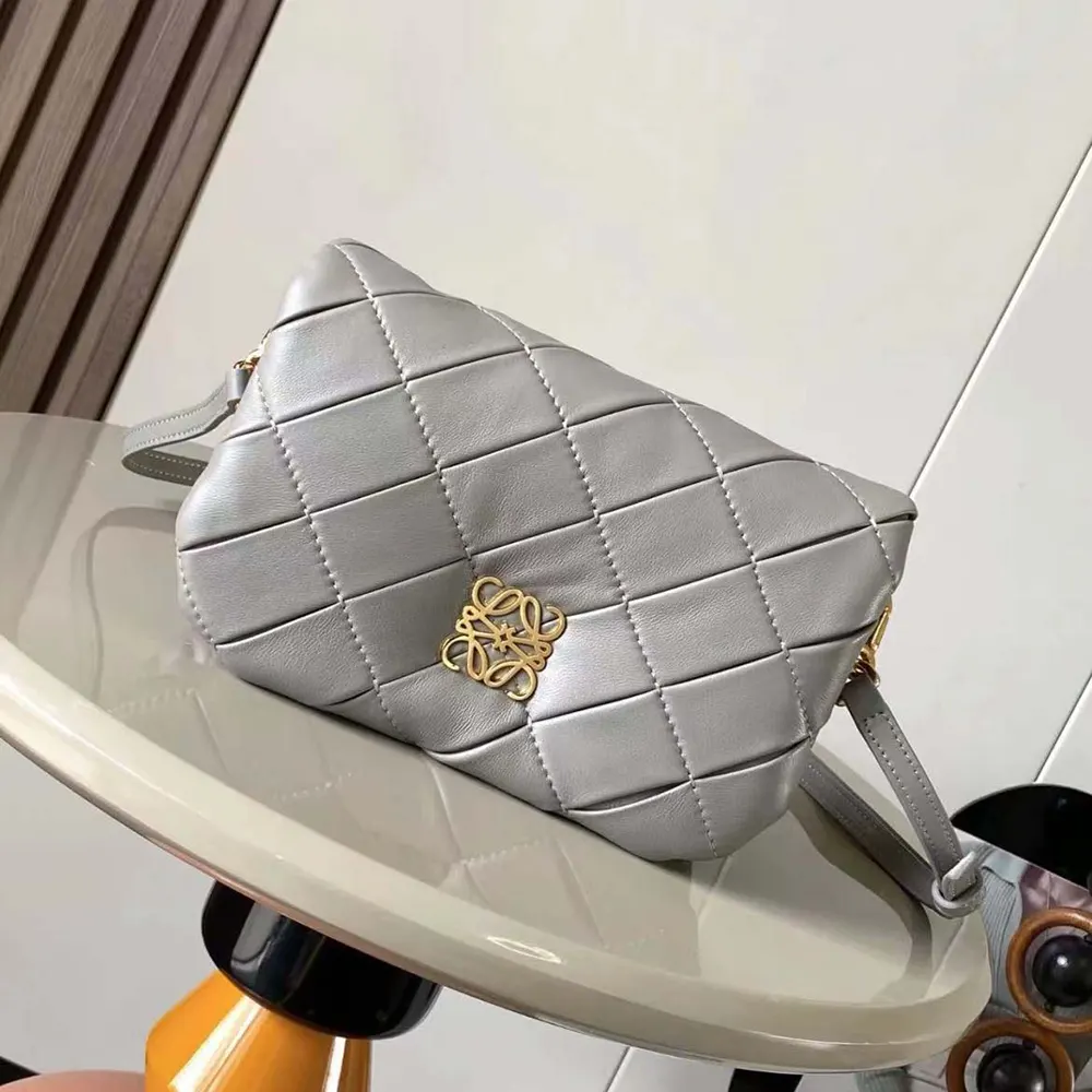 Close-up of pleated shiny nappa lambskin texture on Loewe Mini Puffer Goya bag