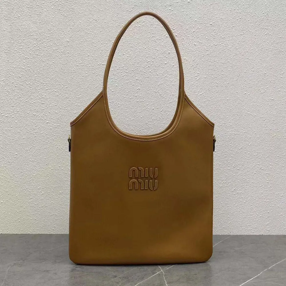 Close-up of polished gold-tone hardware on Miu Miu Women IVY Leather Bag-Brown