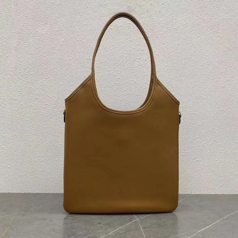 Side angle showing silhouette and adjustable strap of Miu Miu Women IVY Leather Bag-Brown