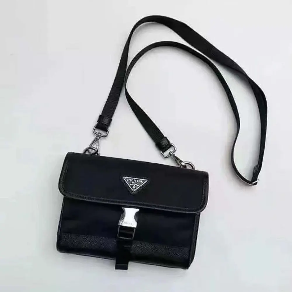 Close-up of silver-tone hardware on Prada Unisex Re-Nylon Shoulder Bag
