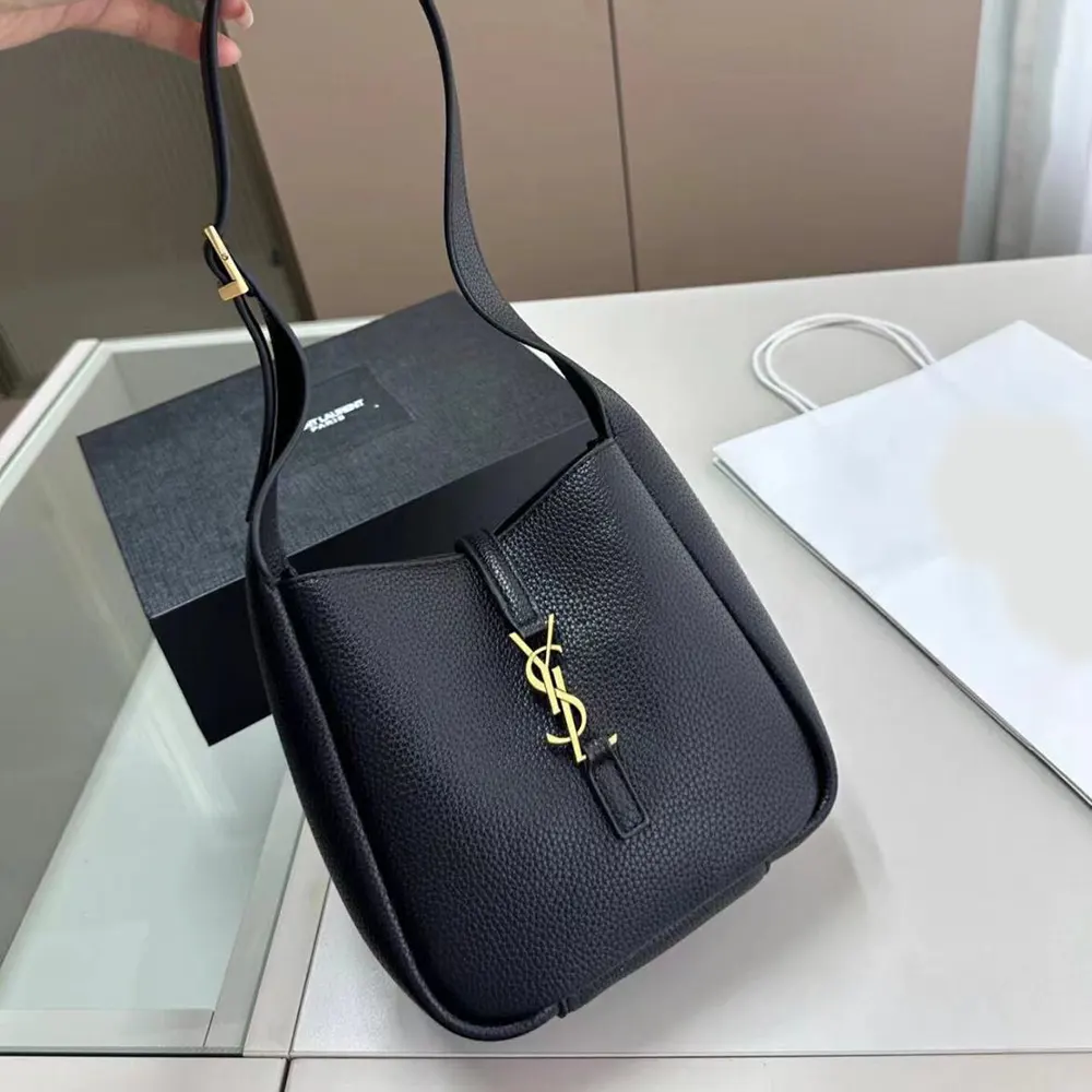 Close-up of gold YSL logo on Saint Laurent YSL Women Le 5 à 7 Supple Baby