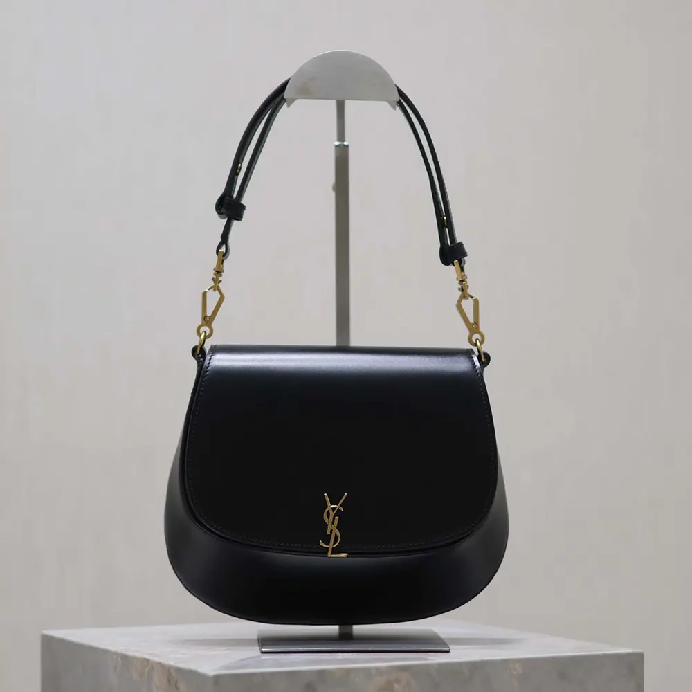 Side angle showing structured silhouette of Voltaire Top Handle bag