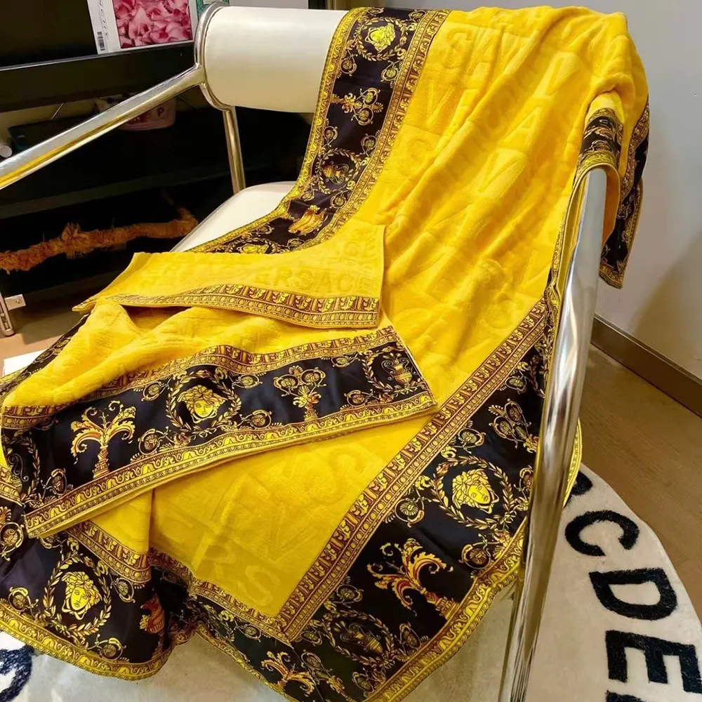 Close-up of embroidered logo on Versace I Love Baroque Beach Towel