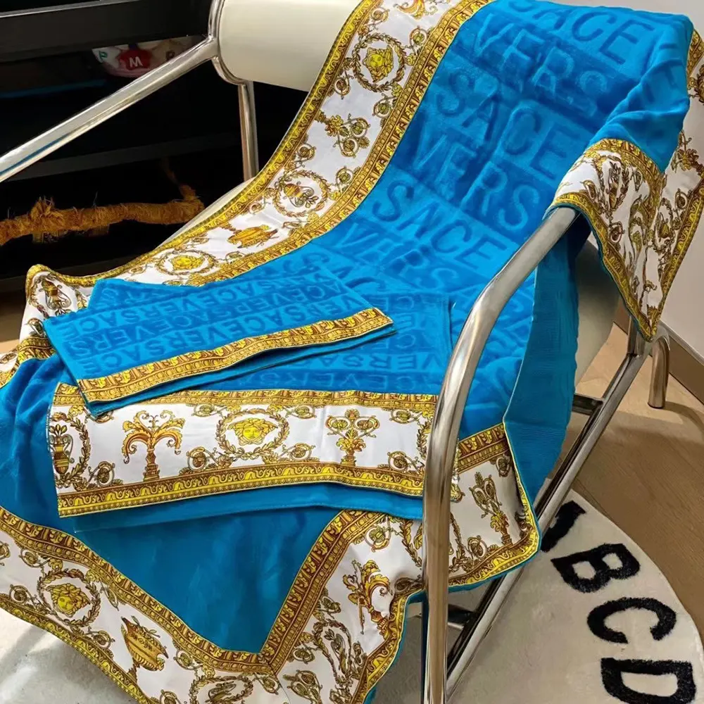 Folded Versace I Love Baroque Beach Towel showing detailed Baroque print