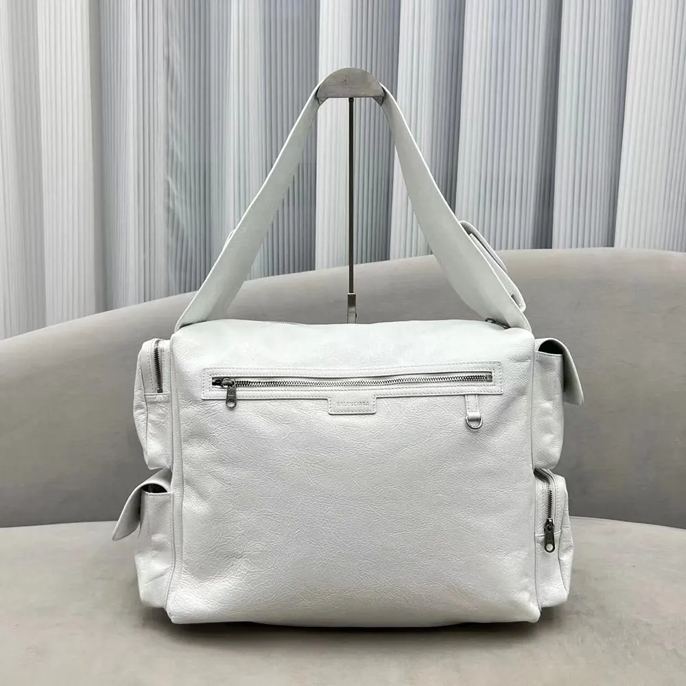 Side profile showing curved silhouette of Balenciaga Women Superbusy Large Sling Bag