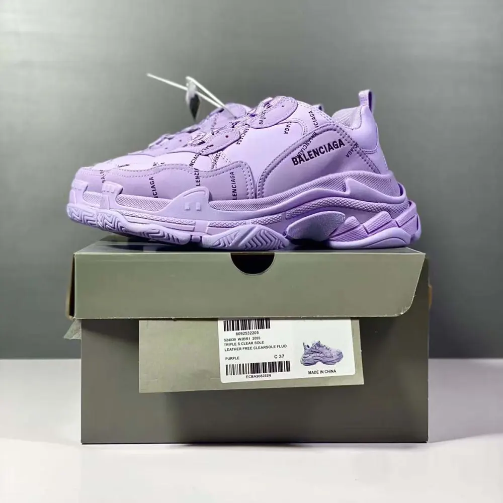 Close-up of logo print and leather mesh on Balenciaga Women Triple S Sneaker