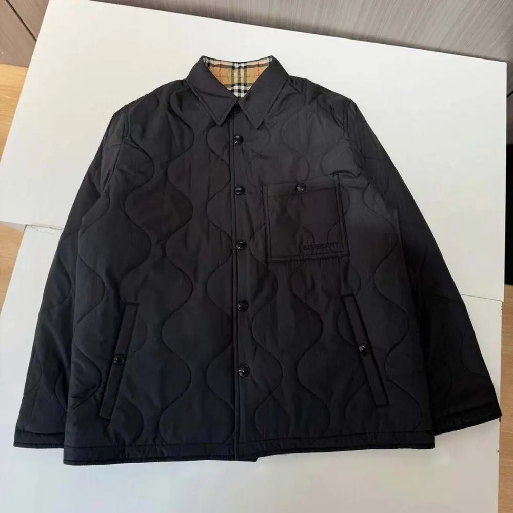 Close-up of Burberry branded buttons on the reversible overshirt