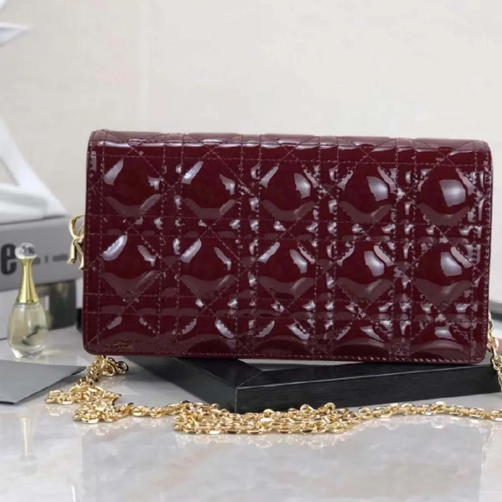 Side angle highlighting the compact silhouette of Dior Lady Dior Pouch Patent Cannage Calfskin-Maroon