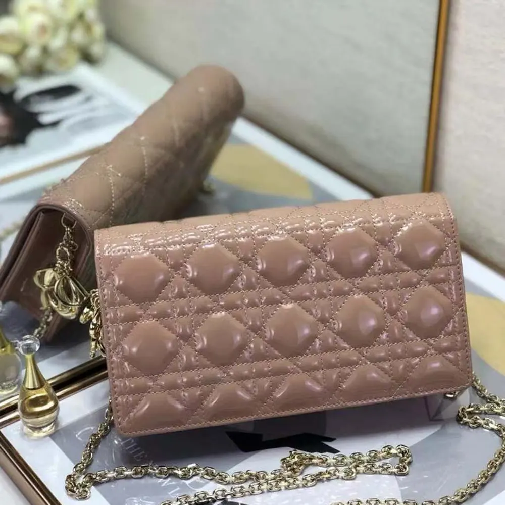 Side angle highlighting slim silhouette of Dior Lady Dior Pouch Sandy