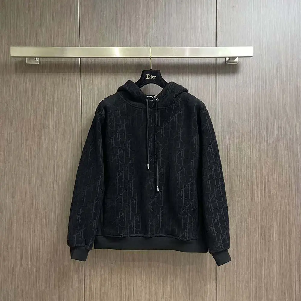 Side angle showing relaxed fit and hood on Dior Men Oblique Sweatshirt
