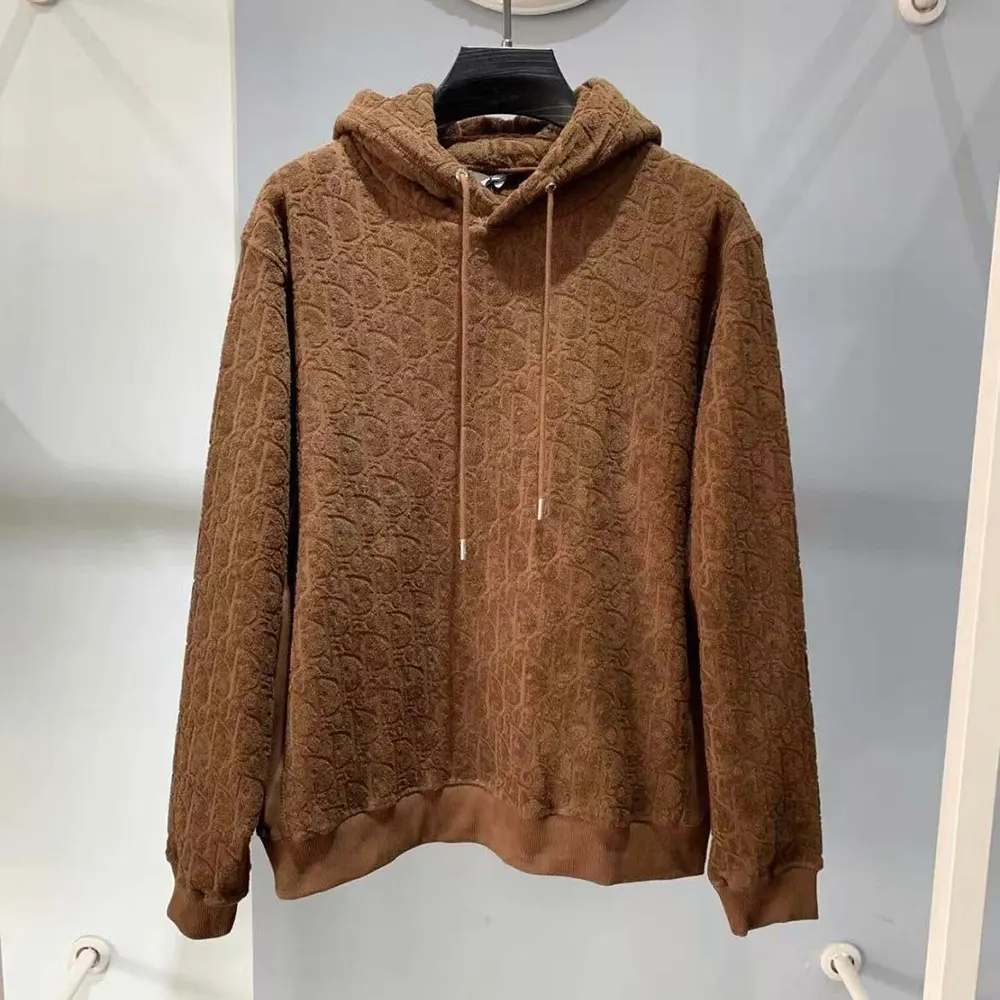 Close-up of brown terry cotton jacquard fabric on Dior Men Oblique Hoodie