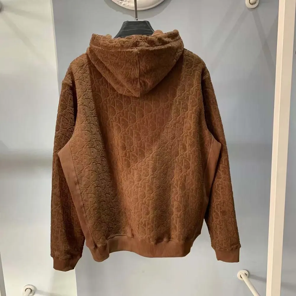 Side angle showing relaxed fit and signature Dior hood detail on sweatshirt