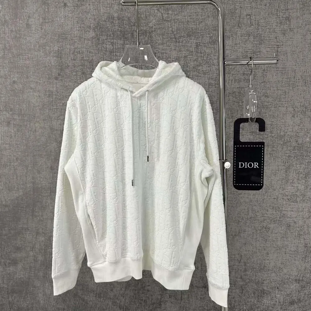 Close-up of Dior Oblique jacquard pattern on sweatshirt fabric