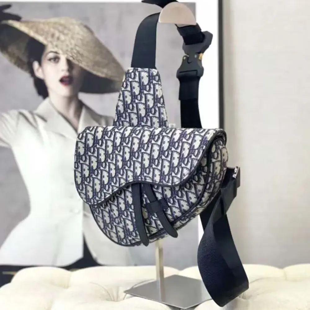 Side profile showing adjustable strap on Dior Men Saddle Bag Beige and Black Dior Oblique Jacquard