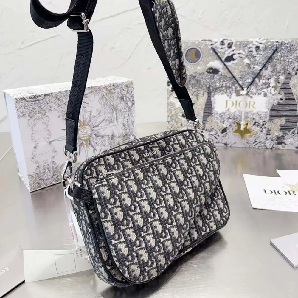 Side angle showing triple pouch compartments on Dior Men Saddle Triple Pouch