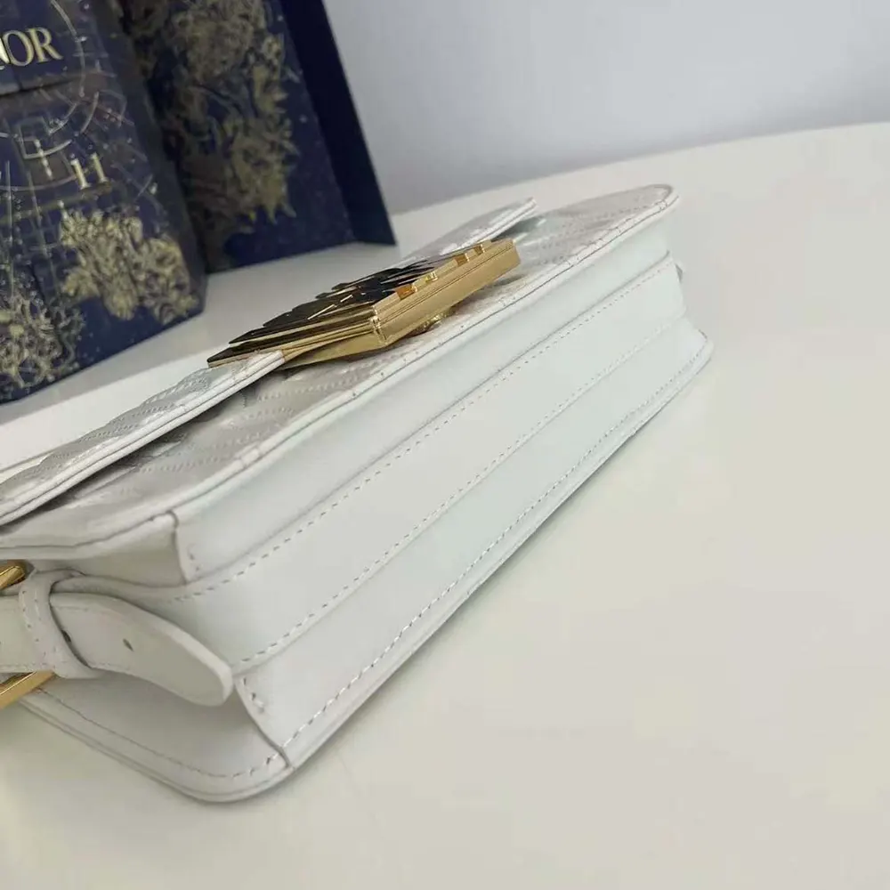 Side angle showing structured silhouette of Dior Women Miss Dior Flap Bag