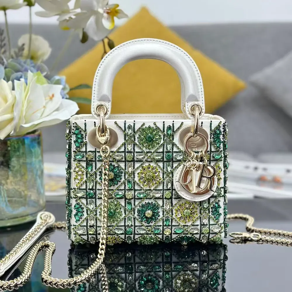 Side angle showing gold hardware and strap of Dior Women Small Lady Dior Bag