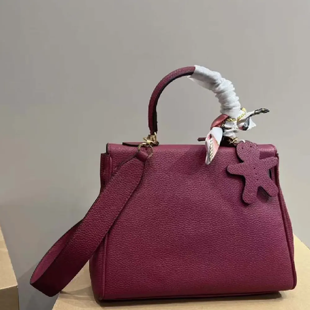 Side profile showing structured silhouette of Hermes Women Kelly Bag 20