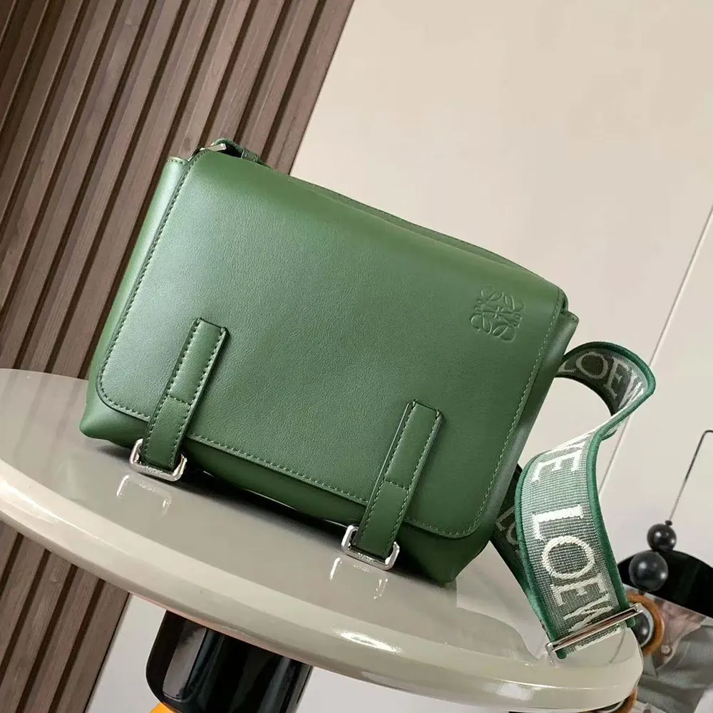 Close-up of jacquard-green canvas and gunmetal hardware details