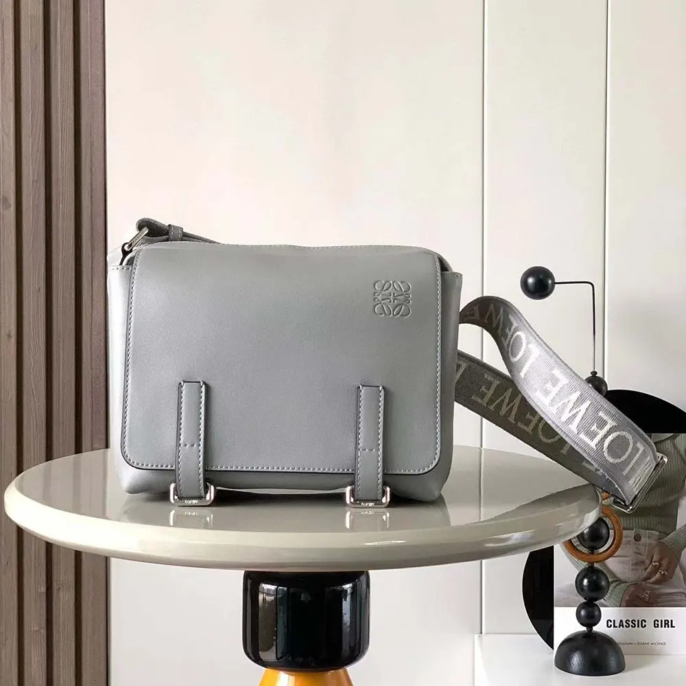 Close-up of jacquard grey fabric and matte silver hardware detail