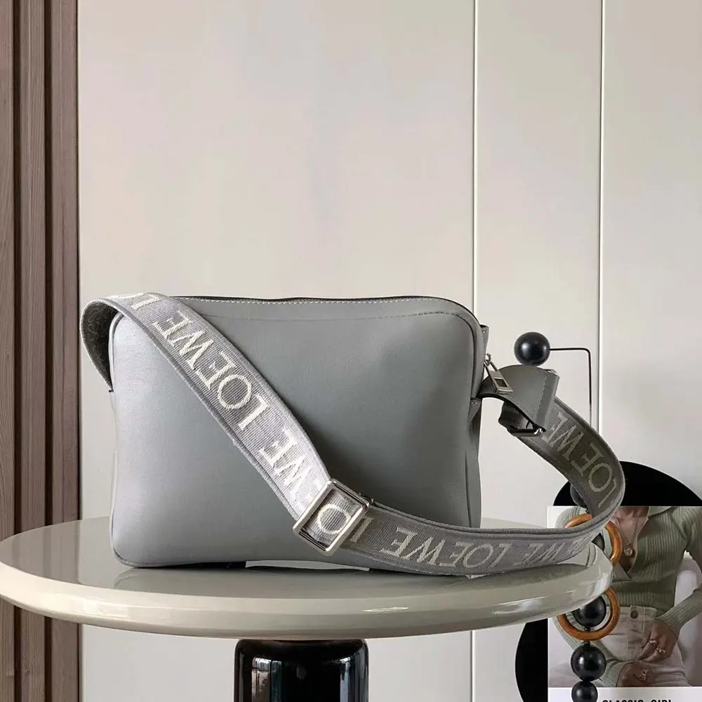 Side angle showing compact silhouette of Loewe Men XS Military Messenger Bag