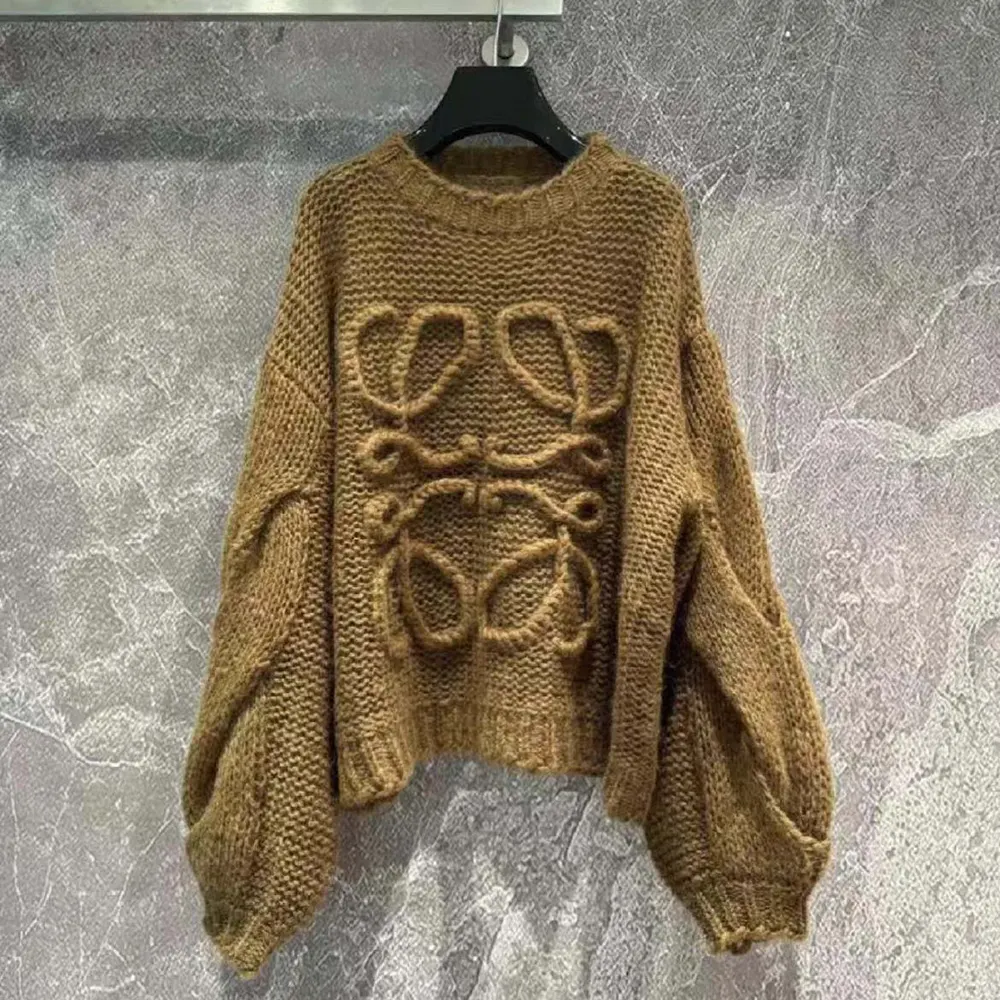 Close-up of embroidered Anagram on brown Loewe sweater