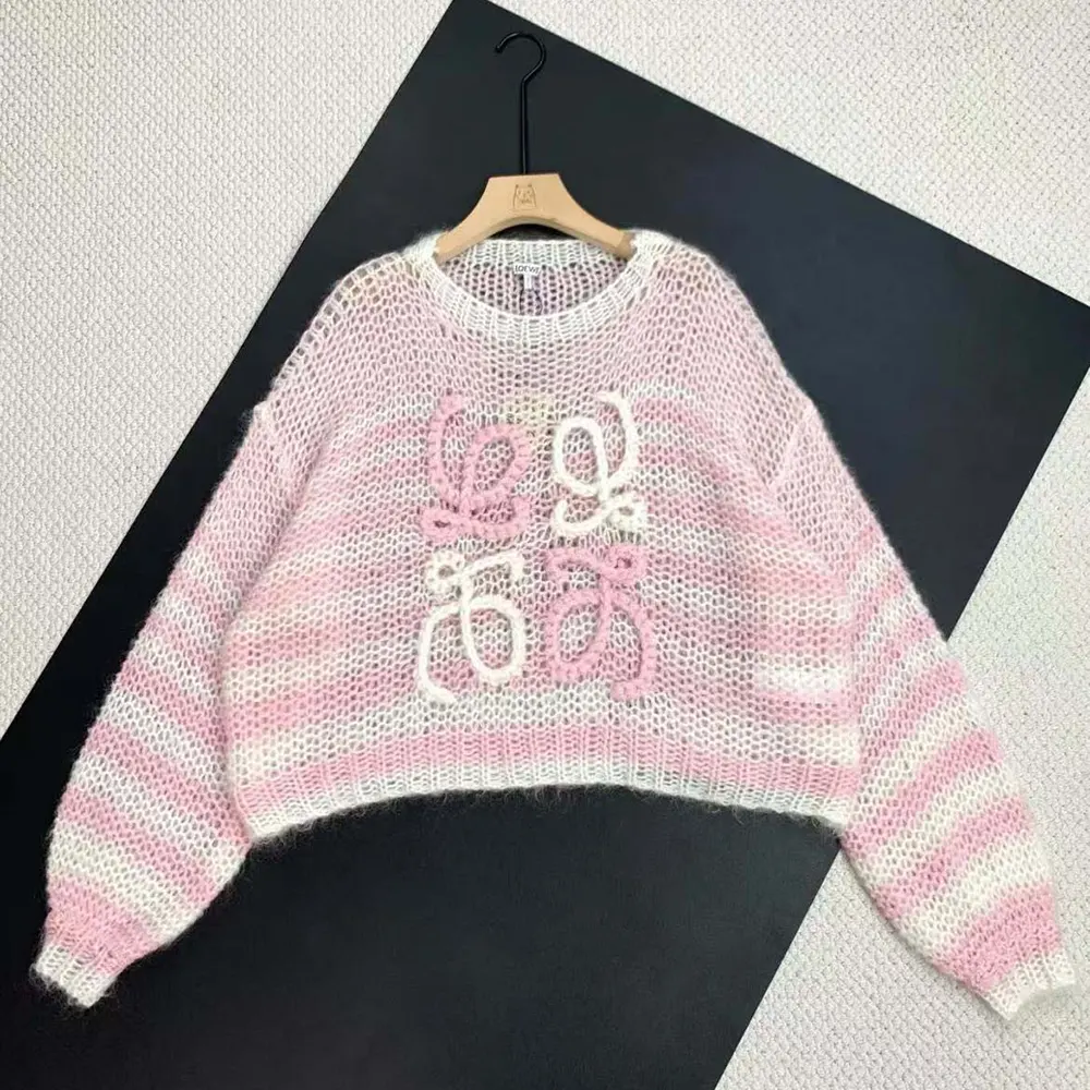 Close-up of Loewe Anagram embroidery on pink mohair sweater