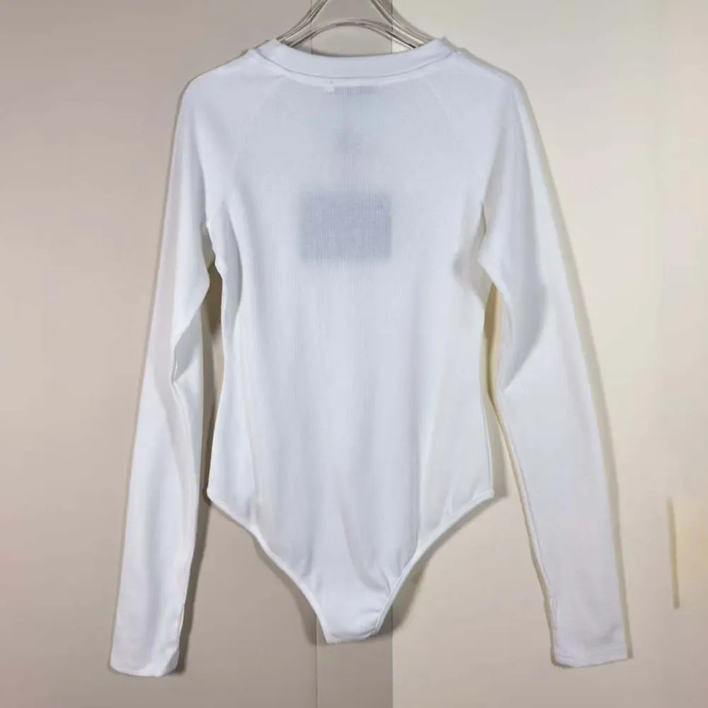Close-up of ribbed knit texture on Prada Women Ribbed Knit Jersey Bodysuit-White