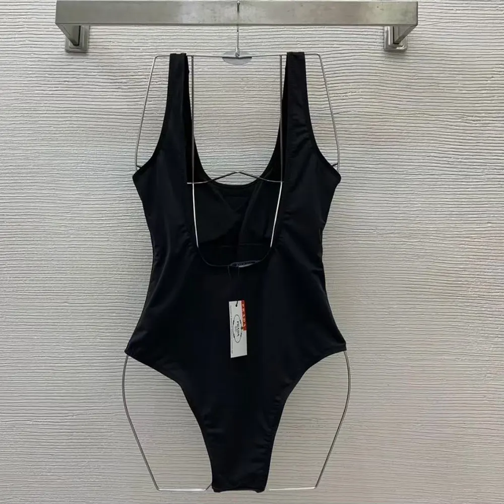 Side profile showing silhouette of Prada Women Stretch Jersey Bodysuit-Black