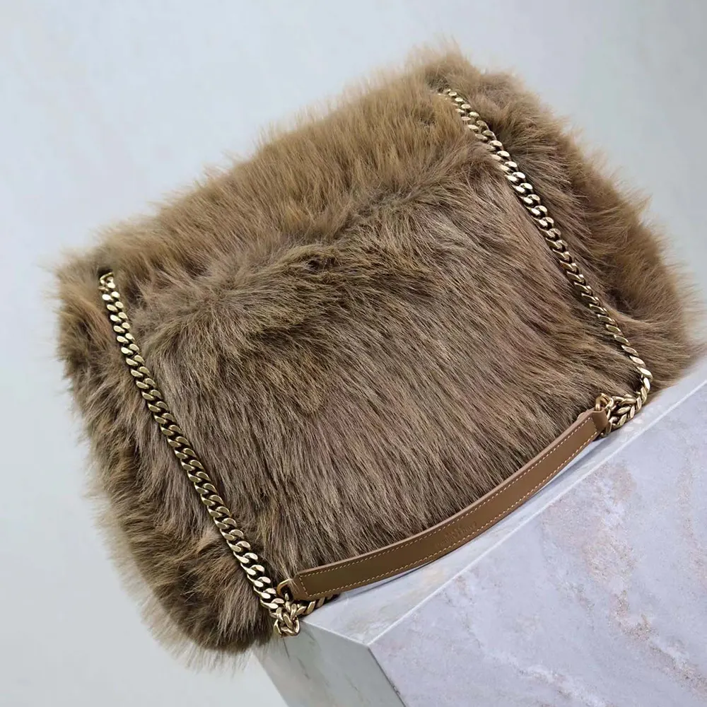 Side angle showcasing soft shearling texture on Saint Laurent YSL Niki Bag
