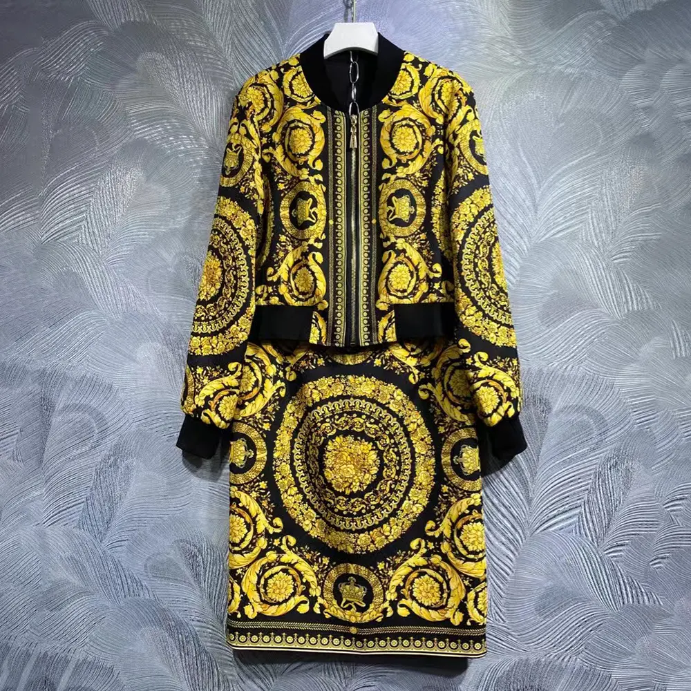 Close-up on gold Medusa emblem hardware on Versace Women Barocco Bomber Skirt-Yellow