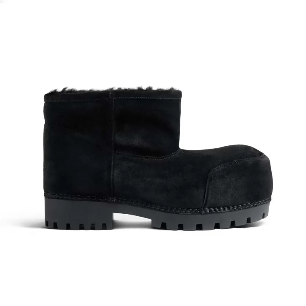 Side view of Balenciaga Unisex Alaska Fur Bootie in black split calfskin