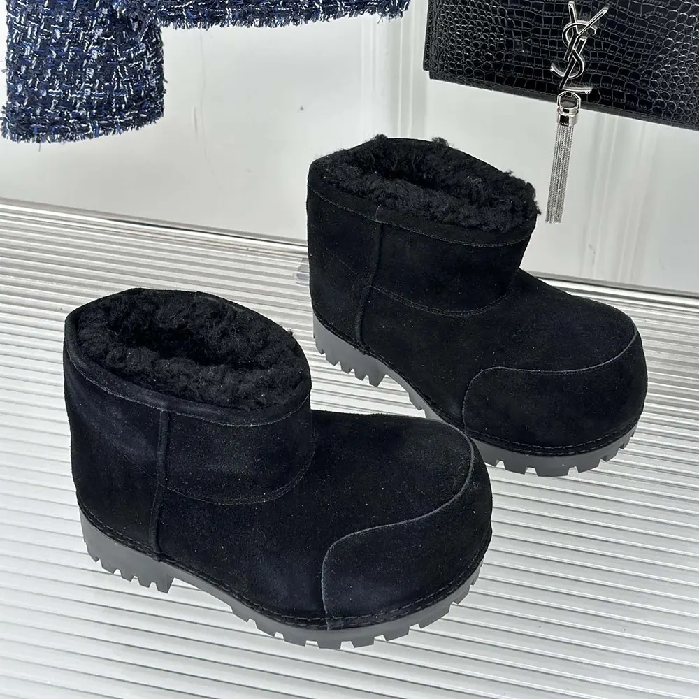 Close-up of fur lining and lace-up closure on Balenciaga Alaska Fur Bootie
