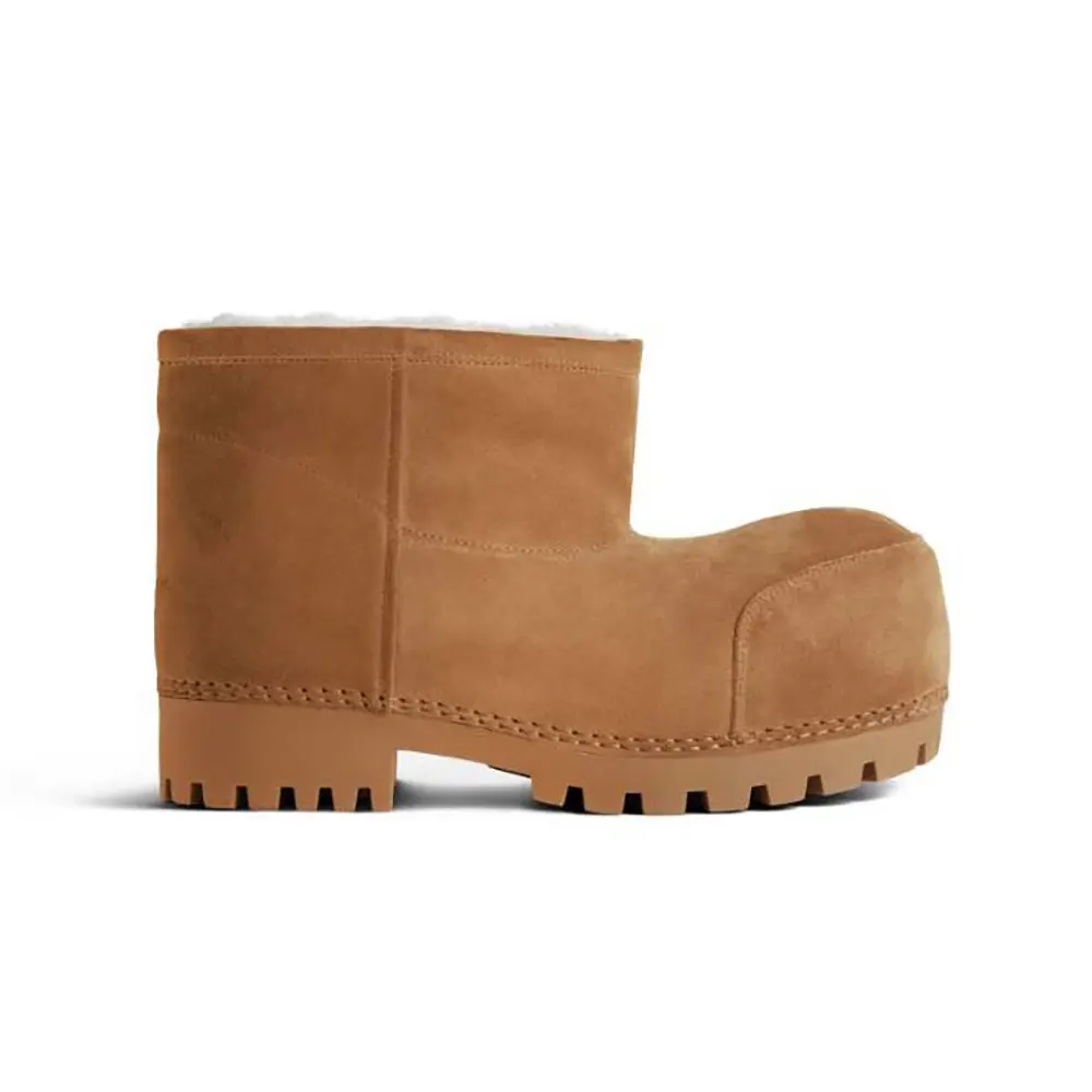 Side view of Balenciaga Unisex Alaska Fur Bootie showing brown calfskin and white panels