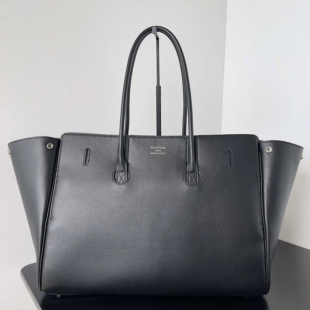 Side angle showing medium size and structured silhouette of Balenciaga Bel Air bag