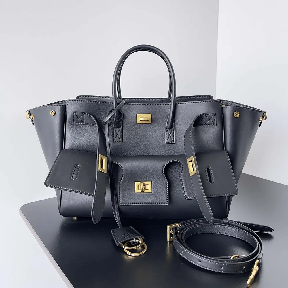 Close-up of gold-tone hardware on Balenciaga Bel Air carry all bag