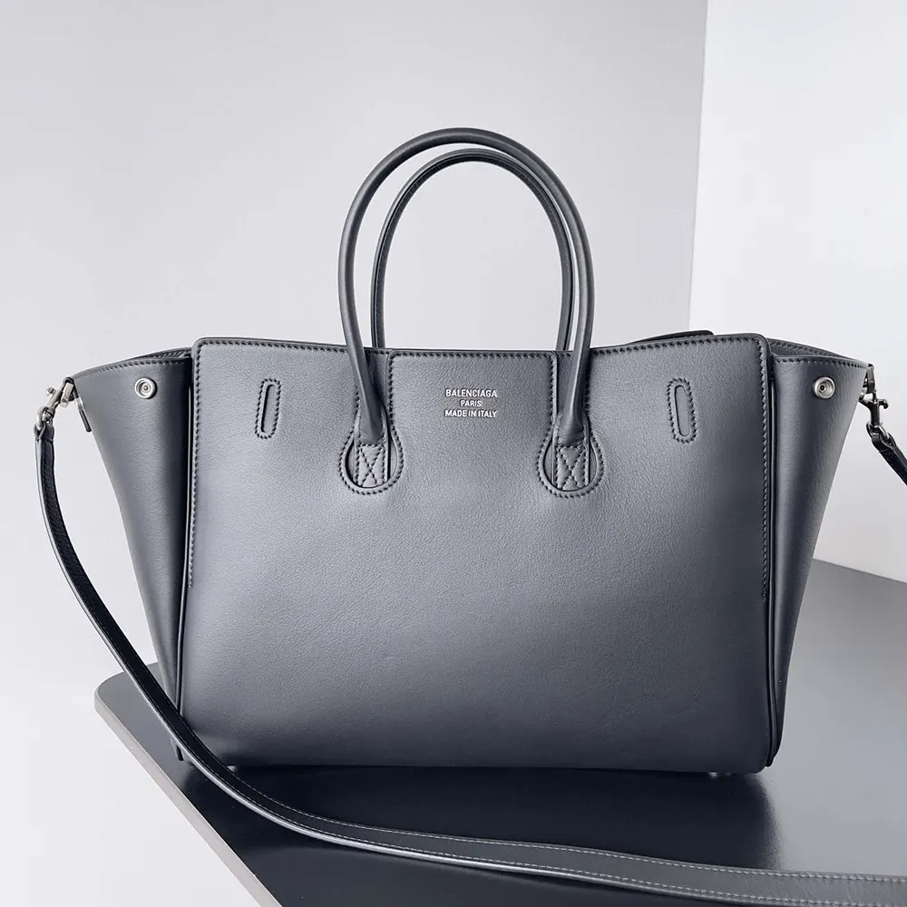 Side angle showing compact silhouette and zip closure of Balenciaga carry all